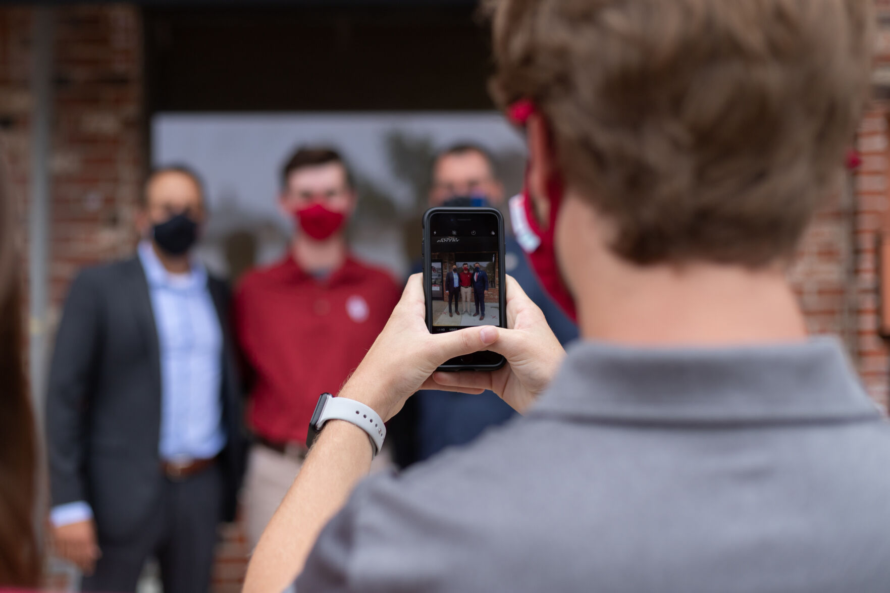 Posing with OU President Joseph Harroz and Oklahoma Governor Kevin Stitt